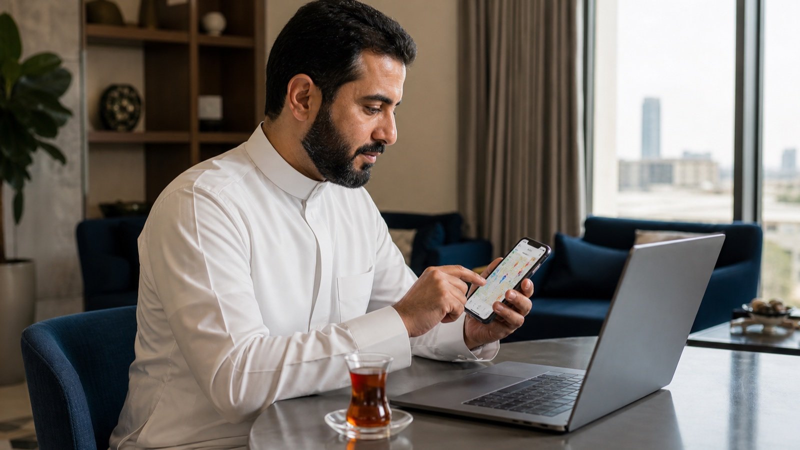 A person in Saudi Arabia comparing local clinic options on a smartphone in a private setting.